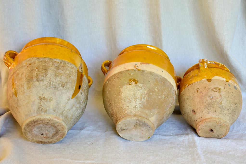 Collection of three antique French confit pots with ochre glaze