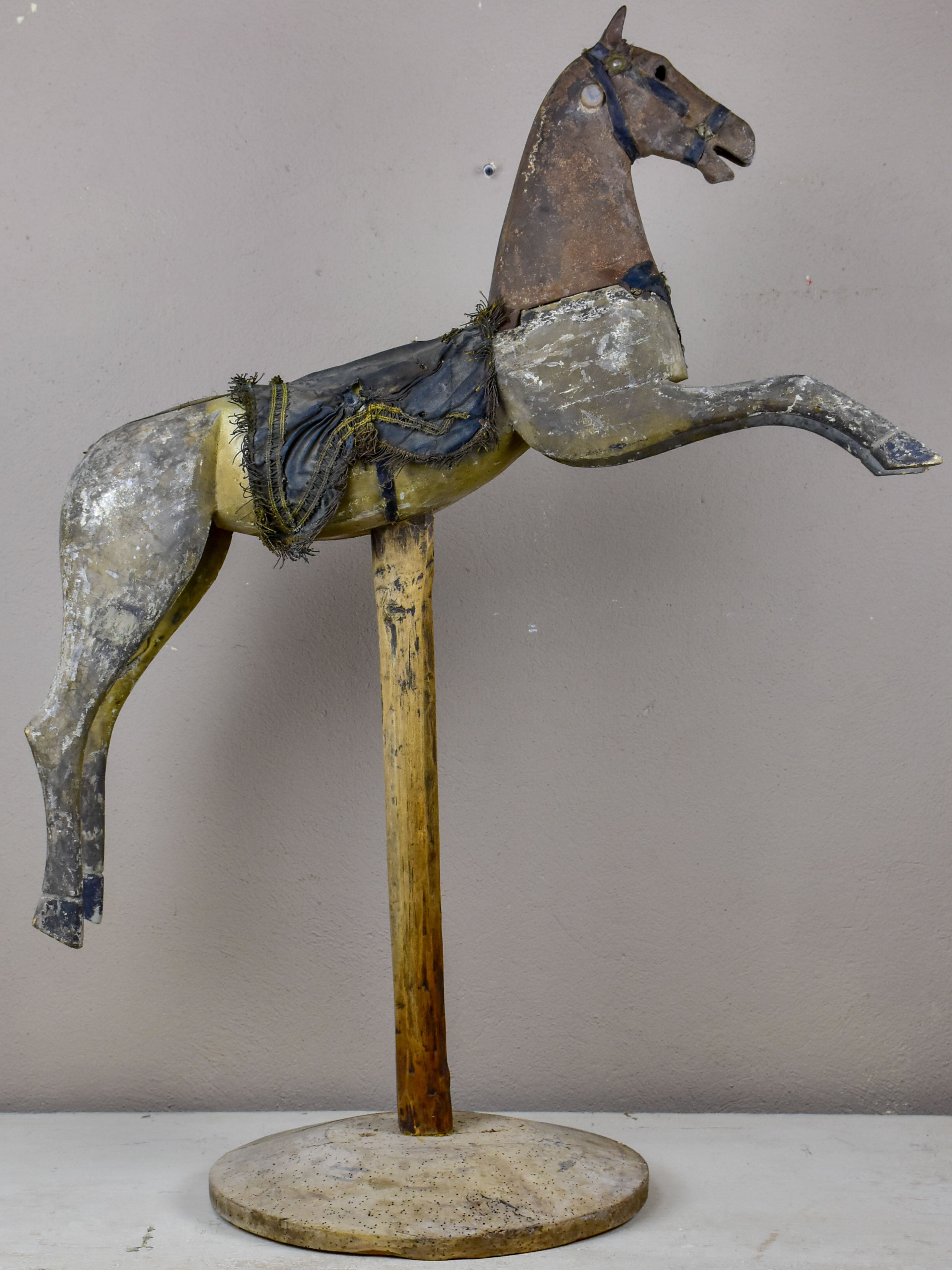 Antique French toy horse mounted on a wooden stand