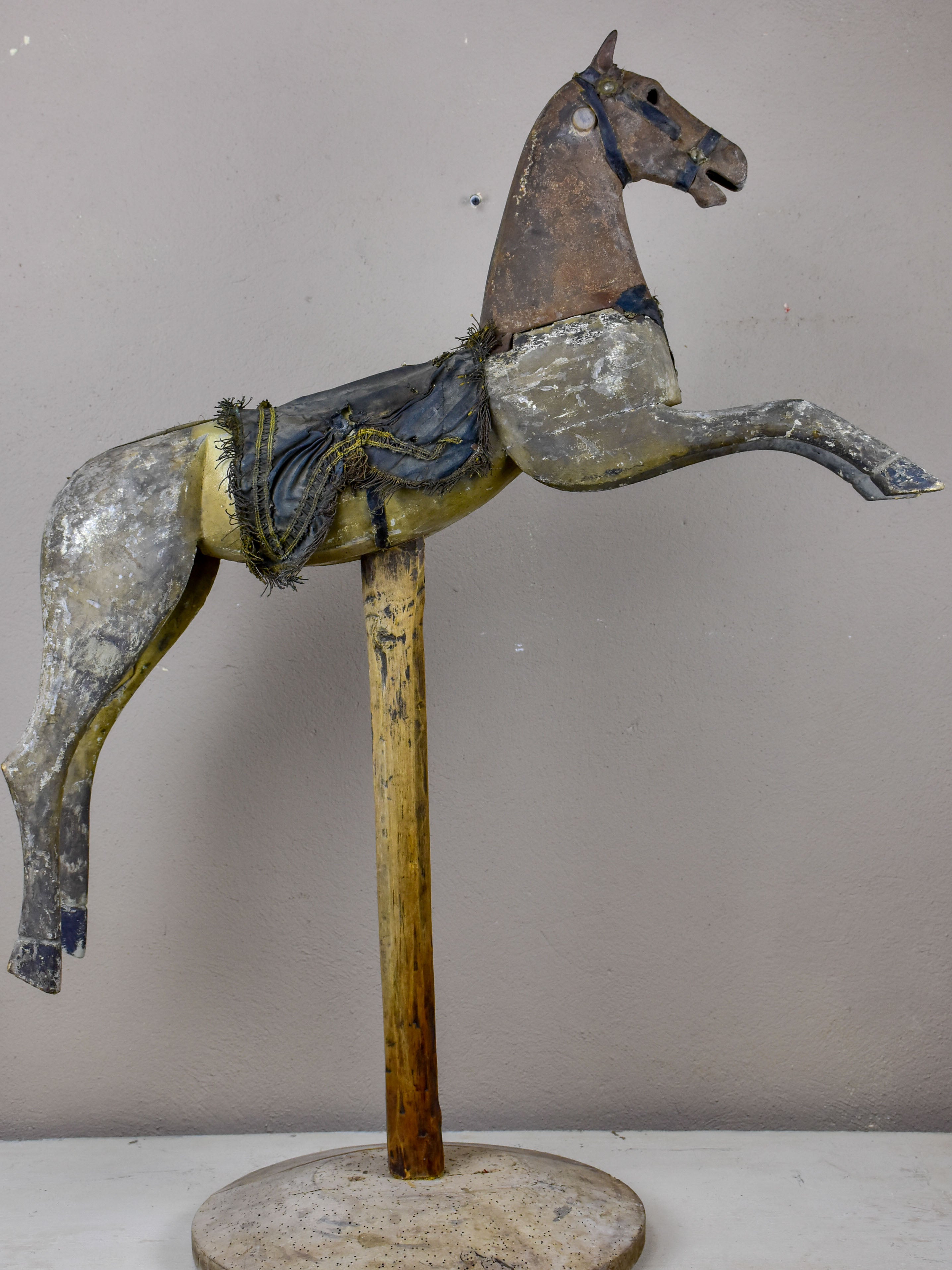 Antique French toy horse mounted on a wooden stand