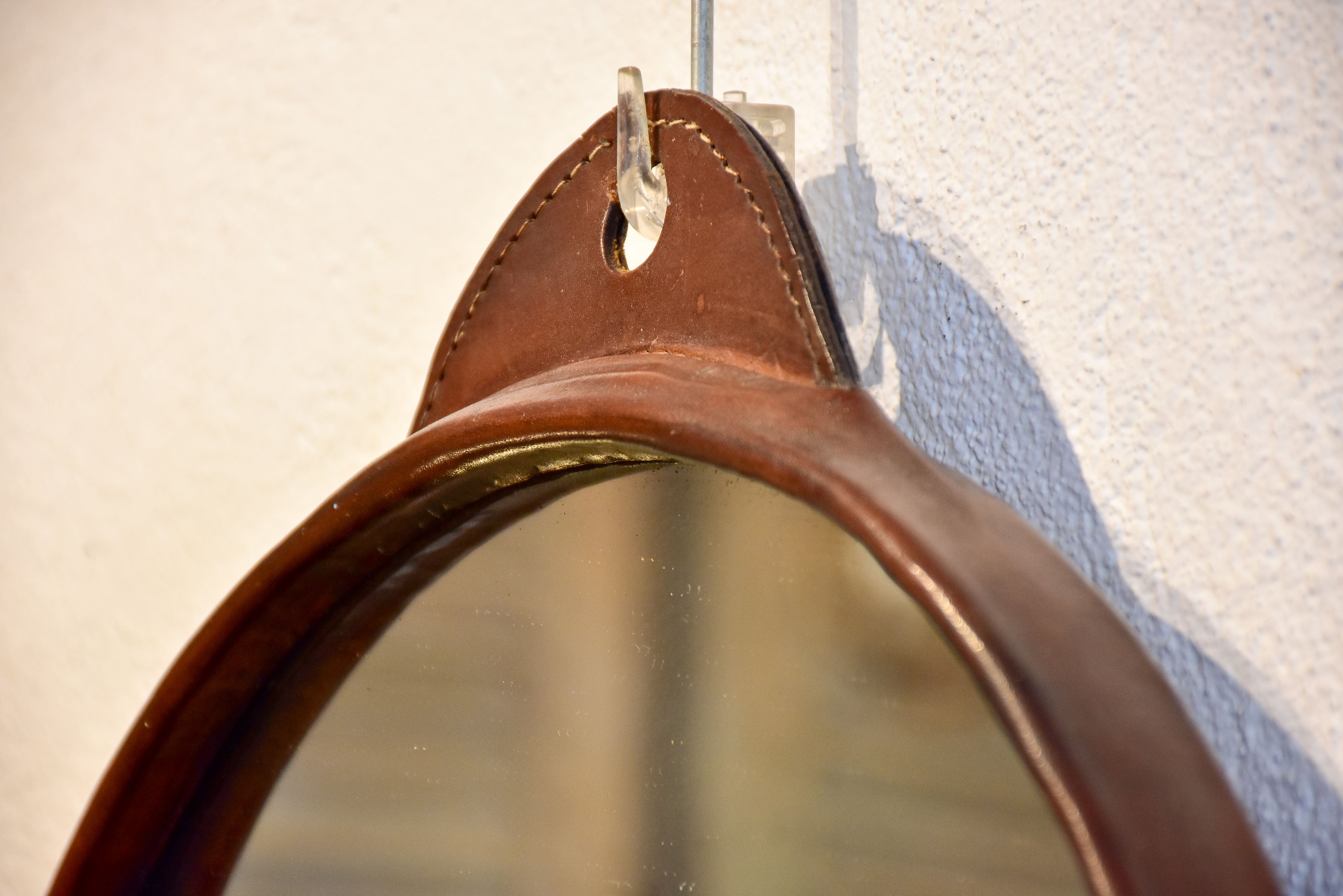 Vintage round mirror with leather frame