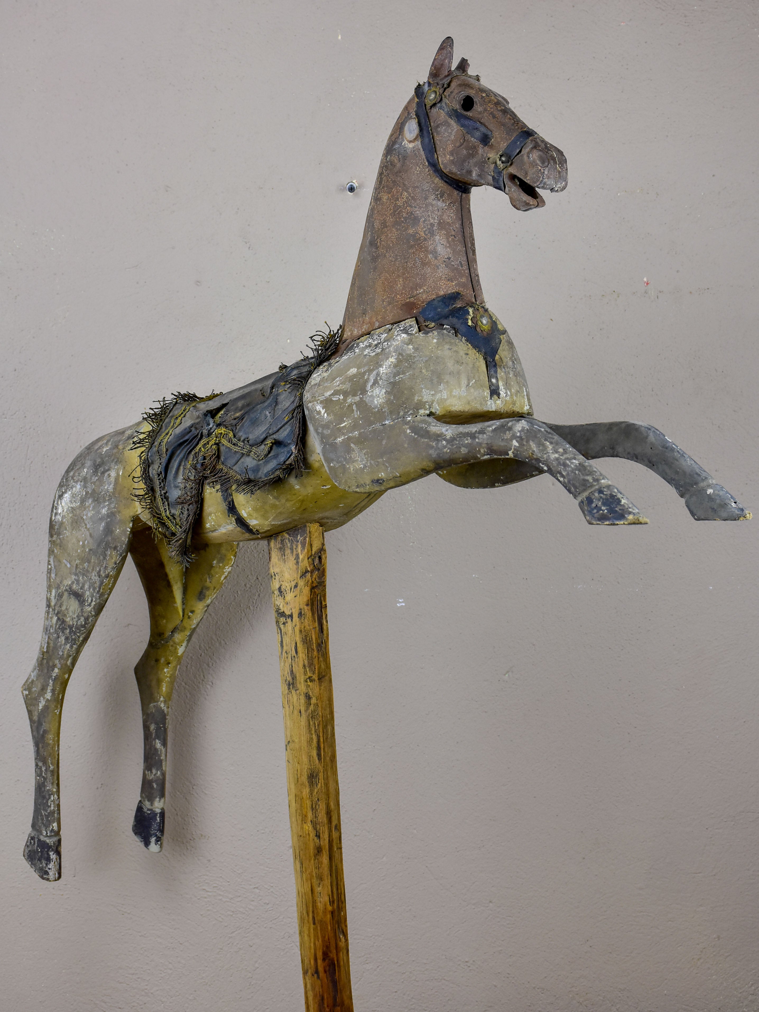 Antique French toy horse mounted on a wooden stand