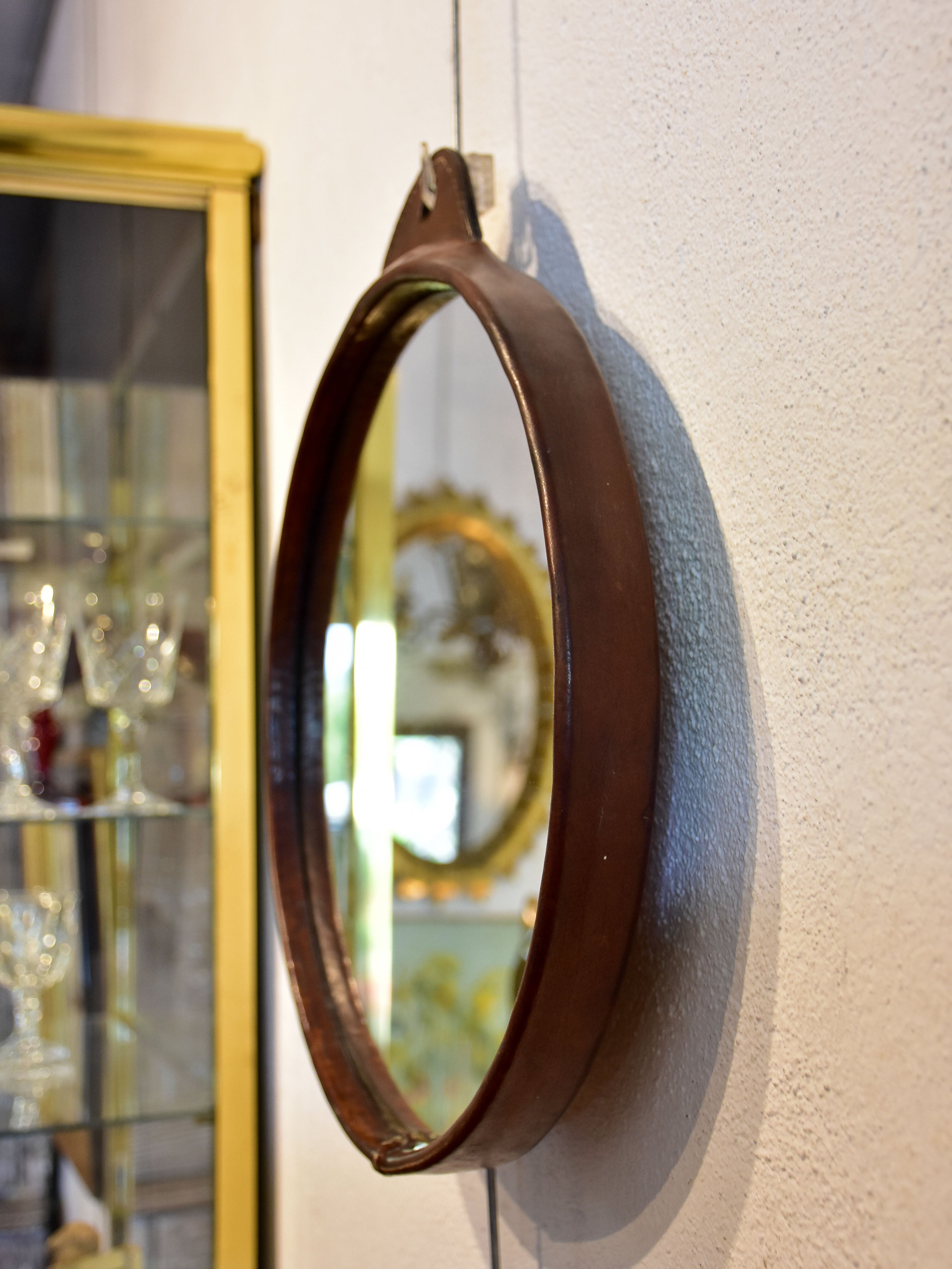 Vintage round mirror with leather frame