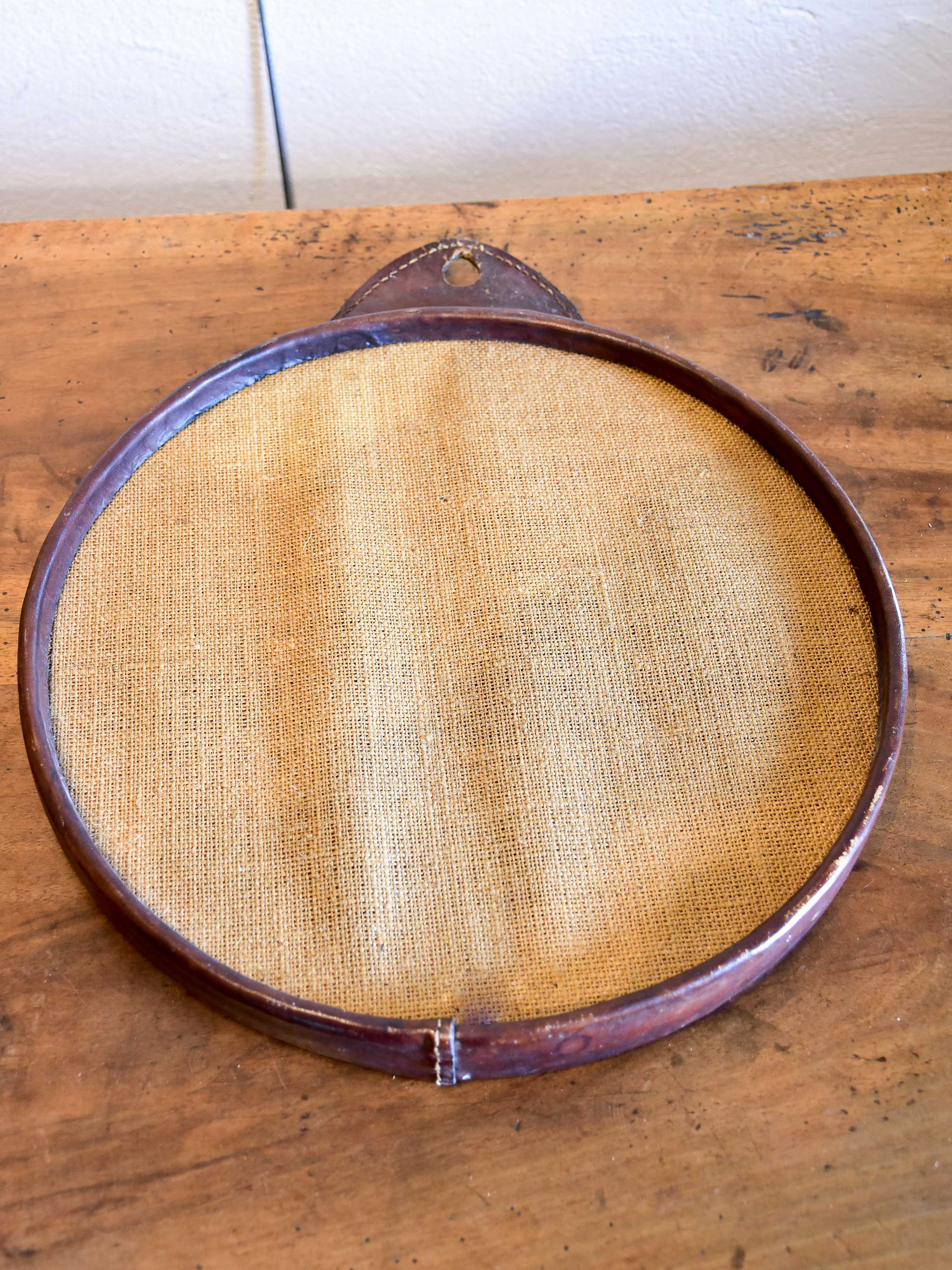 Vintage round mirror with leather frame