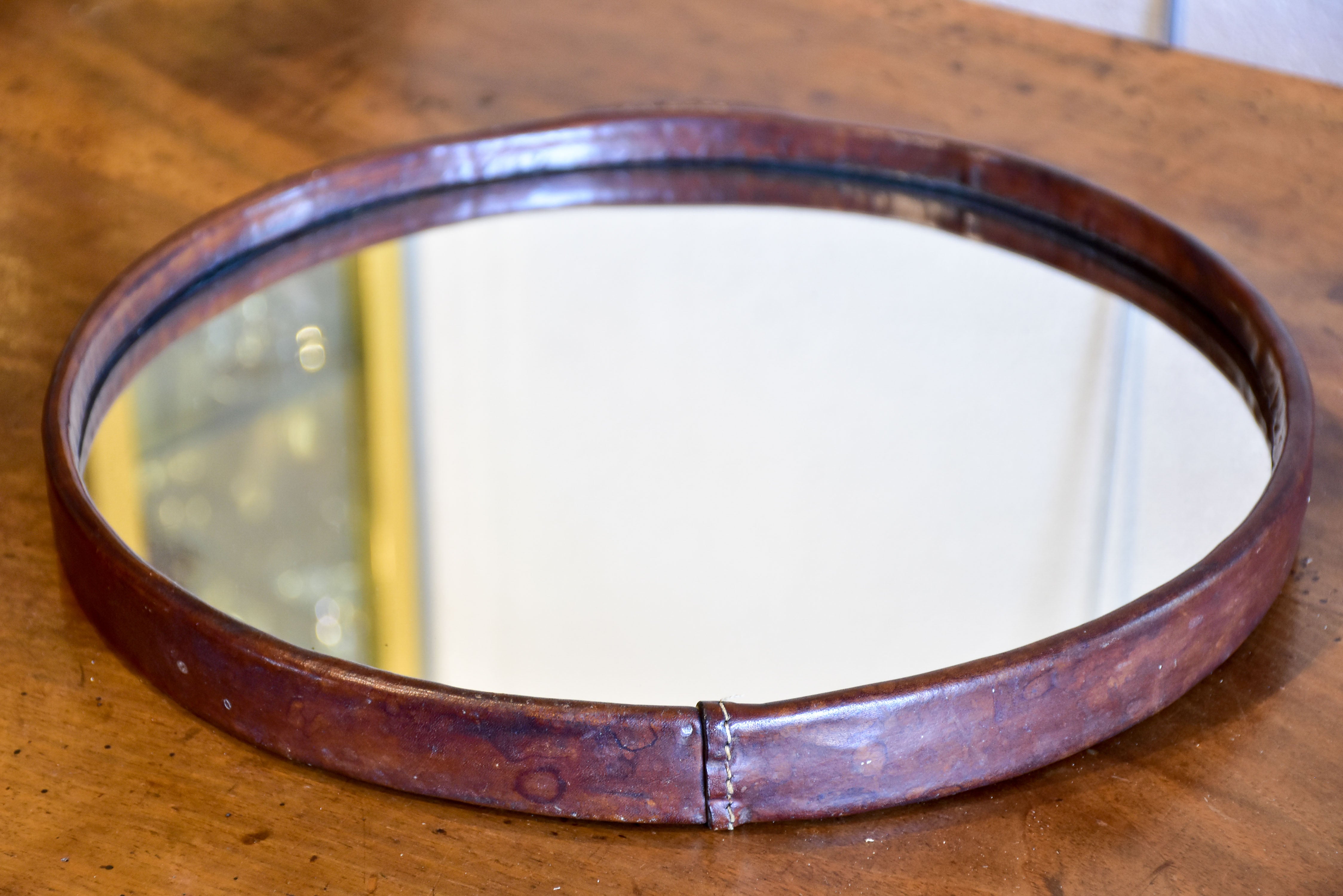 Vintage round mirror with leather frame