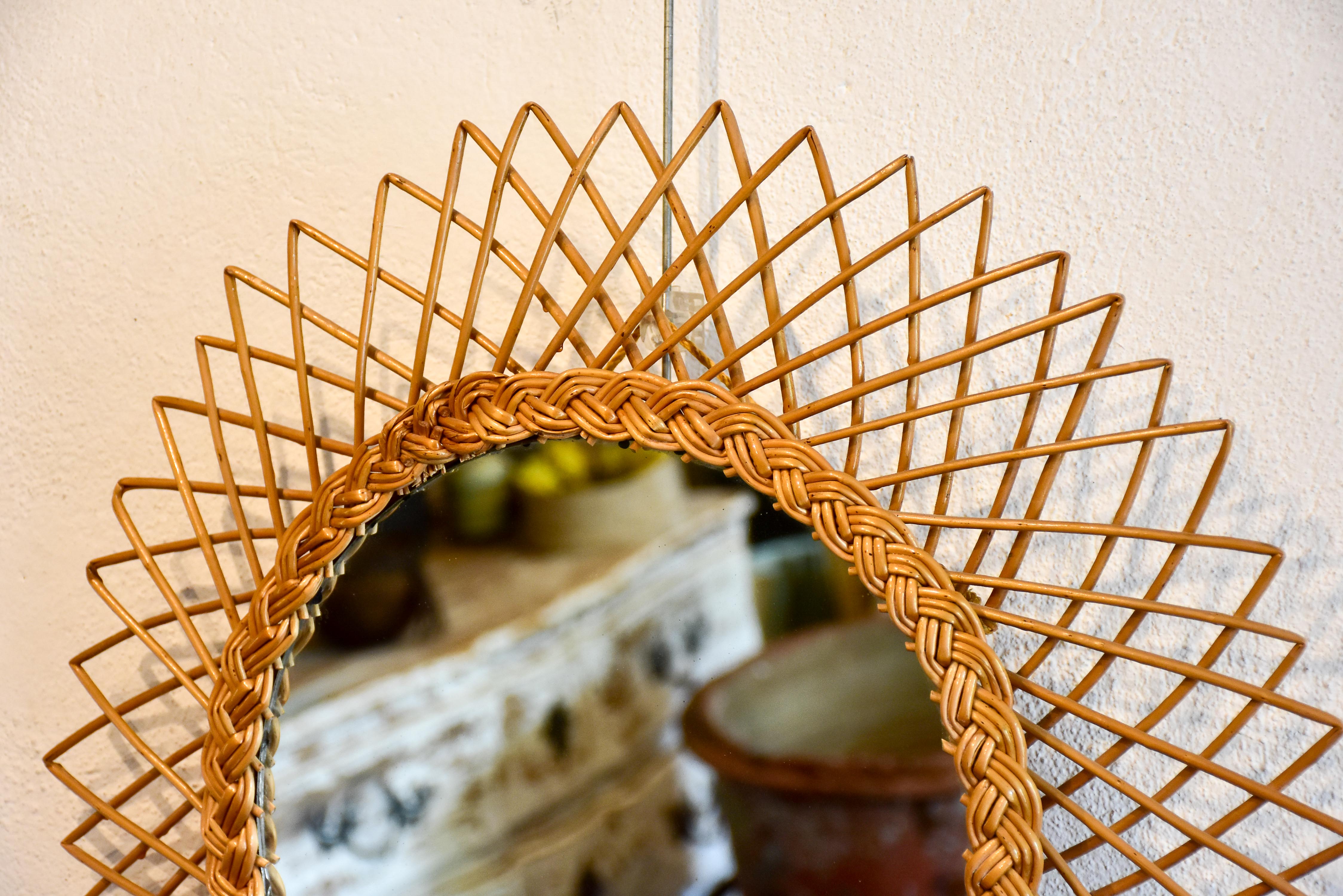 Vintage sunburst mirror with rattan frame