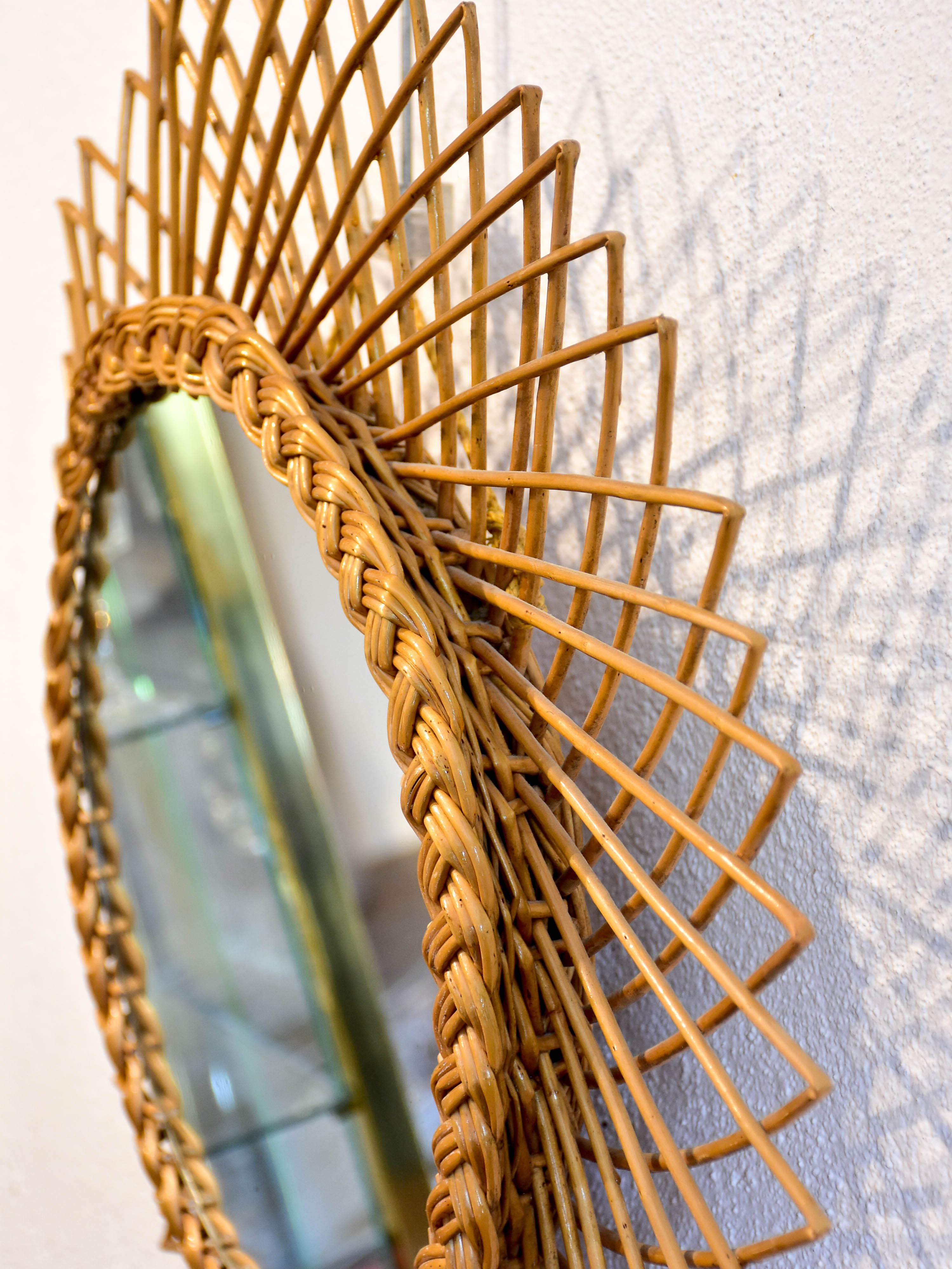 Vintage sunburst mirror with rattan frame