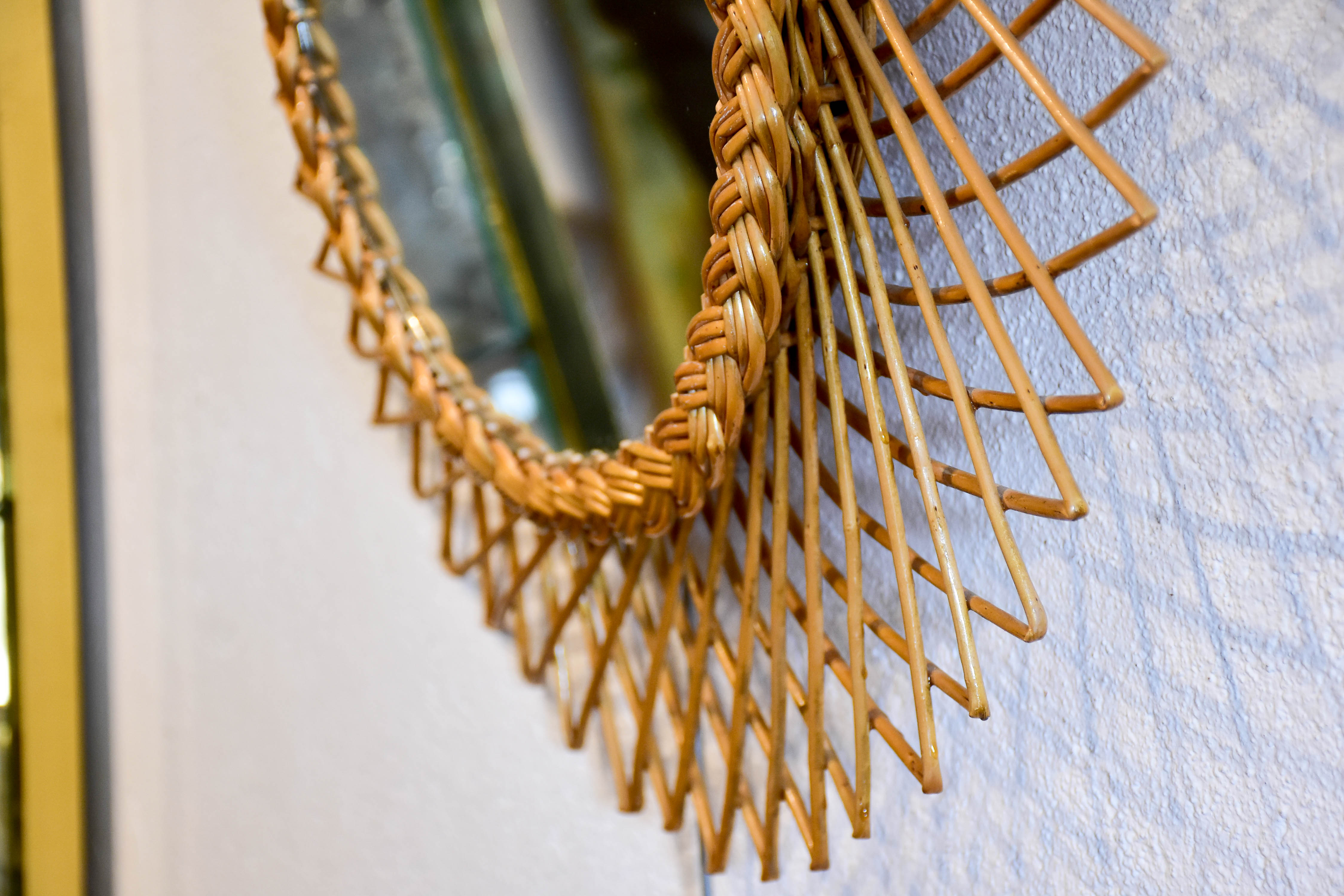 Vintage sunburst mirror with rattan frame