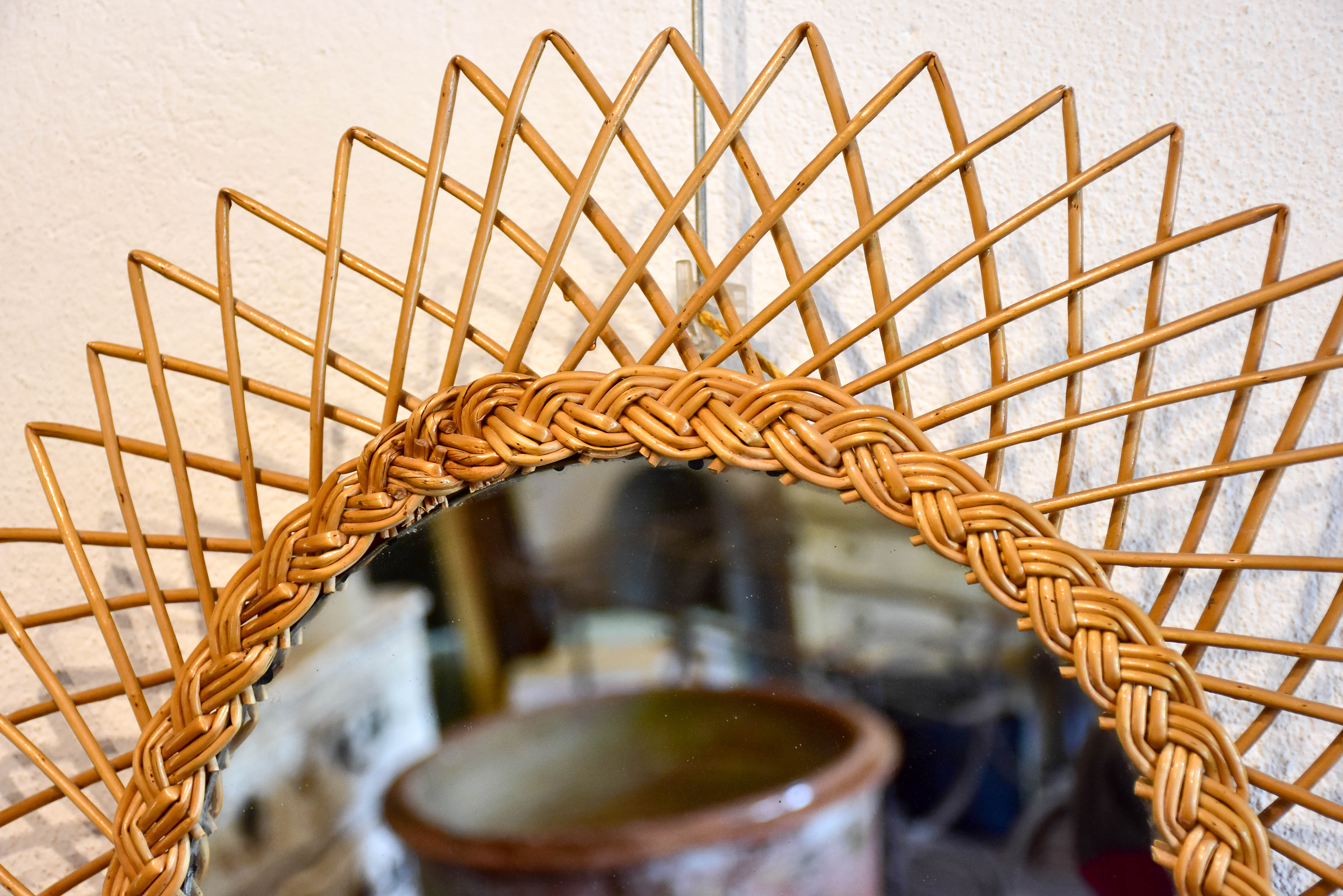 Vintage sunburst mirror with rattan frame