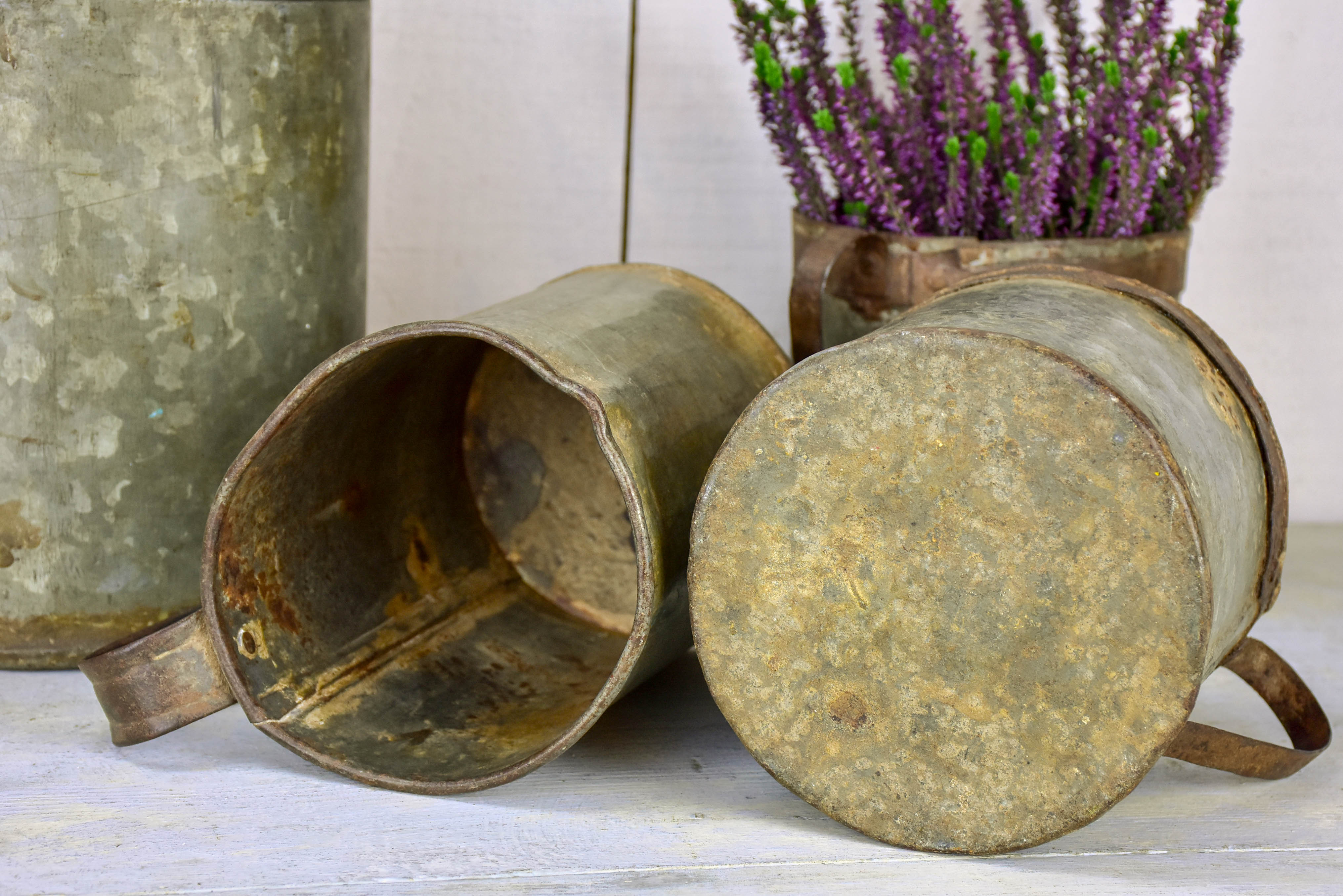 Collection of six antique zinc paint containers