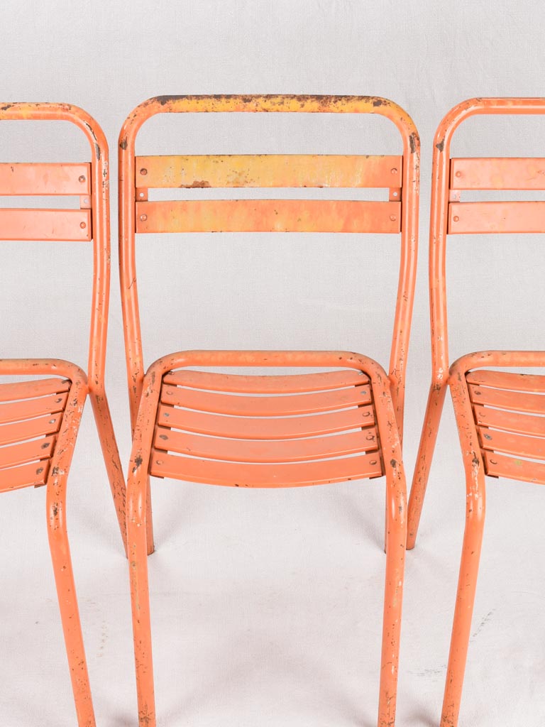 Set of 10 Tolix chairs from the 1950s with orange patina