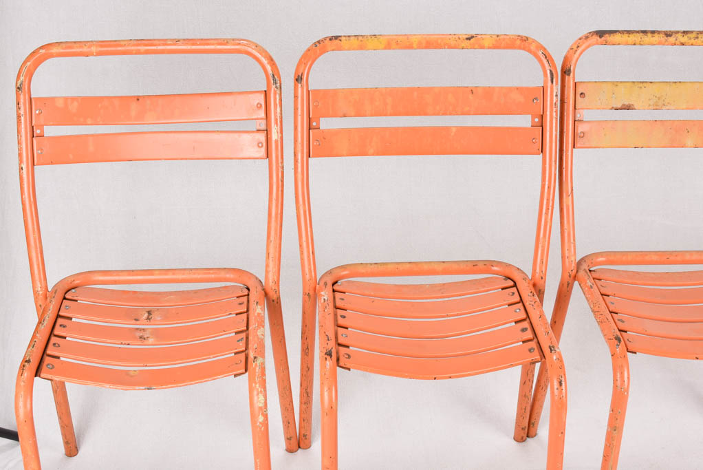 Set of 10 Tolix chairs from the 1950s with orange patina