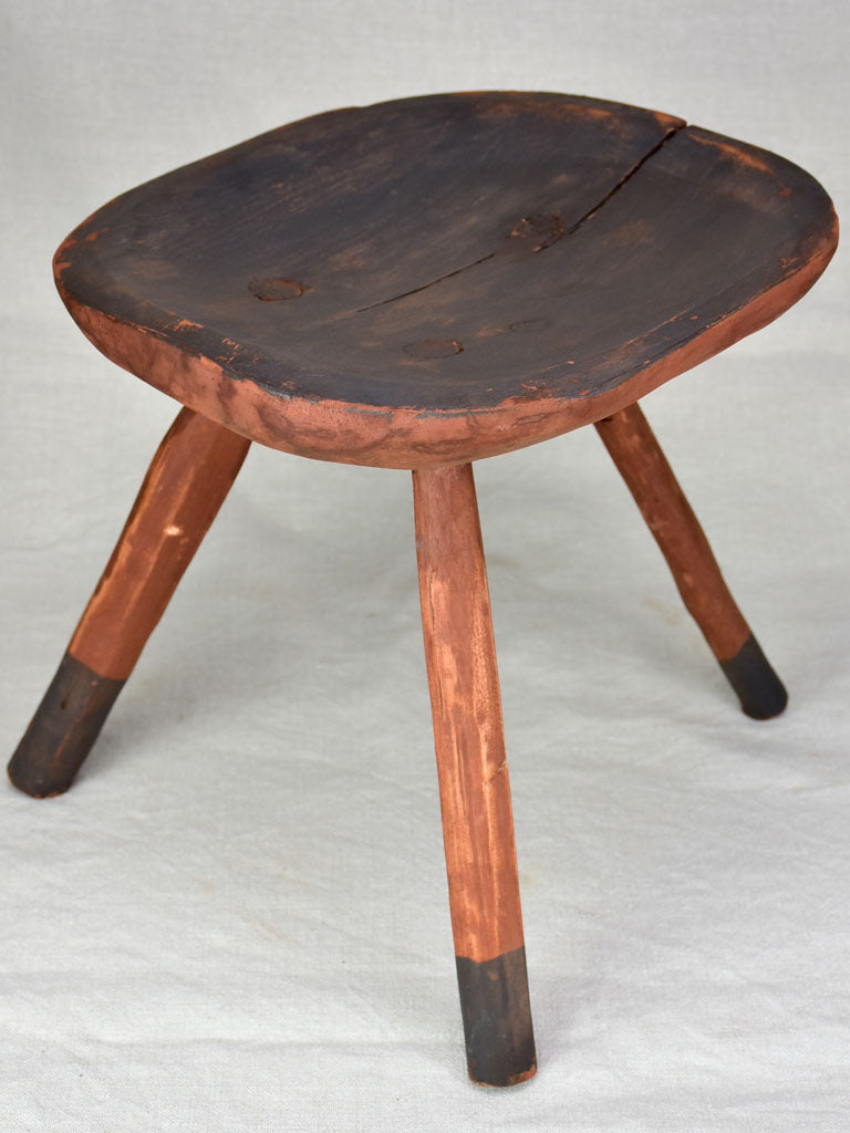 Antique French primitive milking stool with burgundy red paint finish