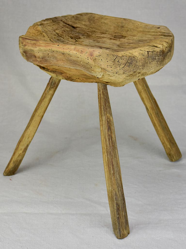 Timeworn antique French primitive milking stool