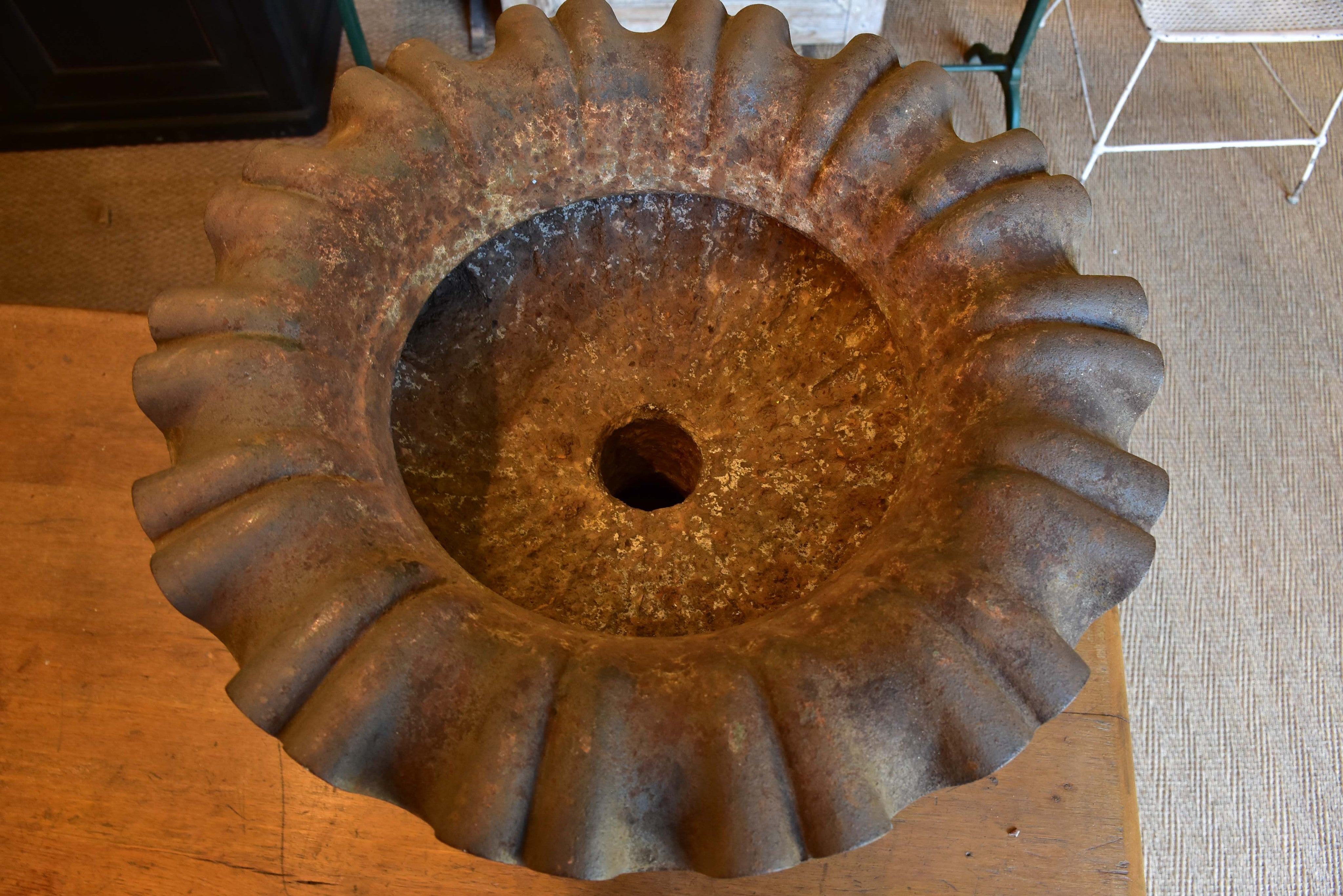 Large antique French urn with lions head handles and rippled edge