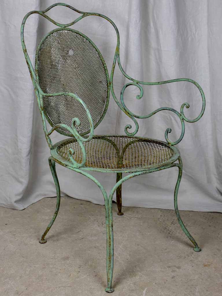 Antique French garden armchair with green patina