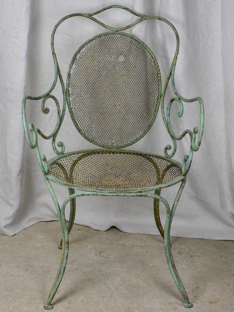 Antique French garden armchair with green patina