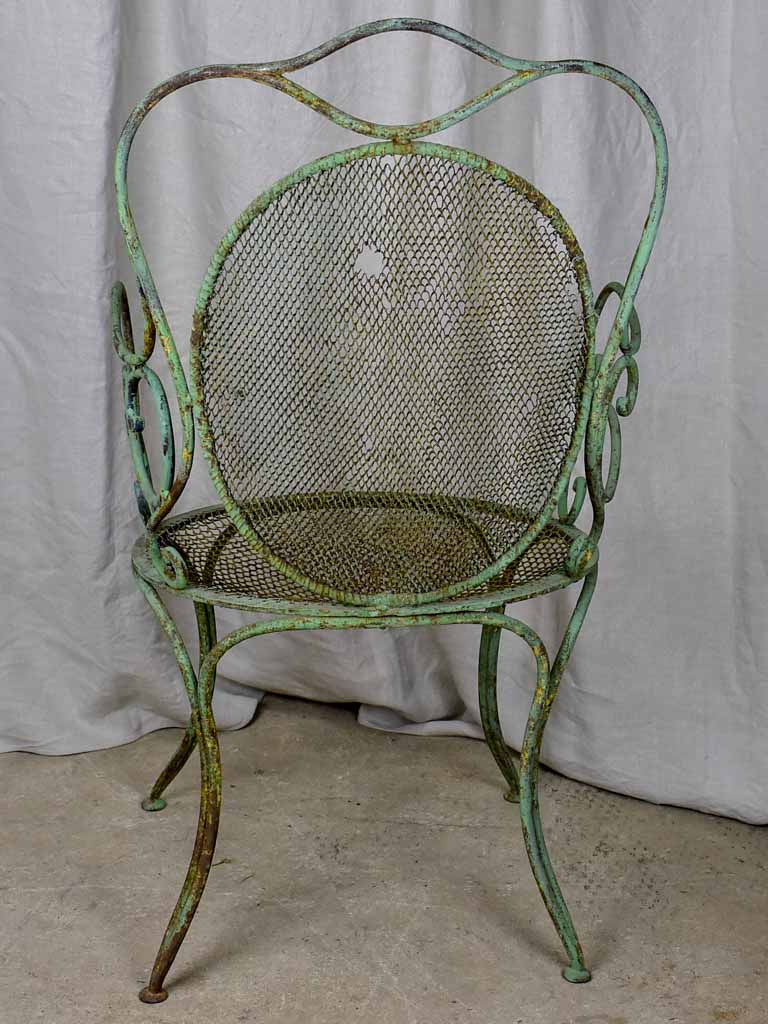 Antique French garden armchair with green patina