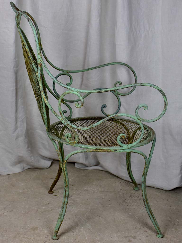 Antique French garden armchair with green patina