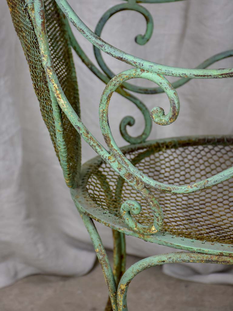 Antique French garden armchair with green patina