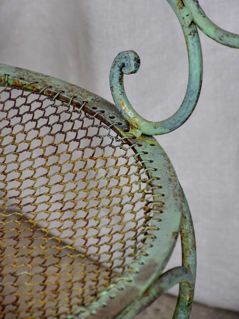 Antique French garden armchair with green patina