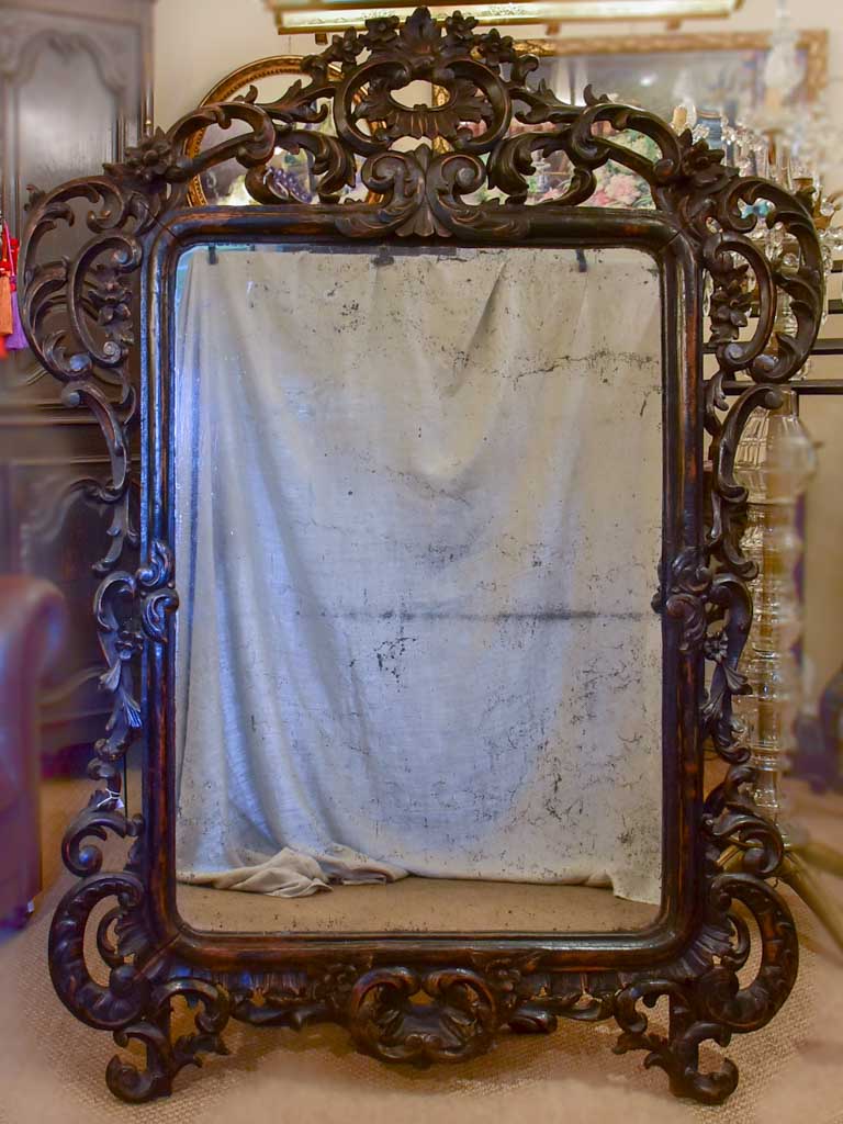 Large late 18th Century carved wood mirror with original black patina and aged glass 45¾" x 63½"