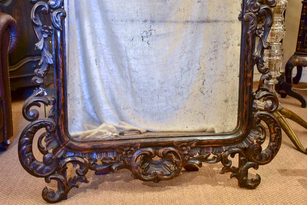 Large late 18th Century carved wood mirror with original black patina and aged glass 45¾" x 63½"