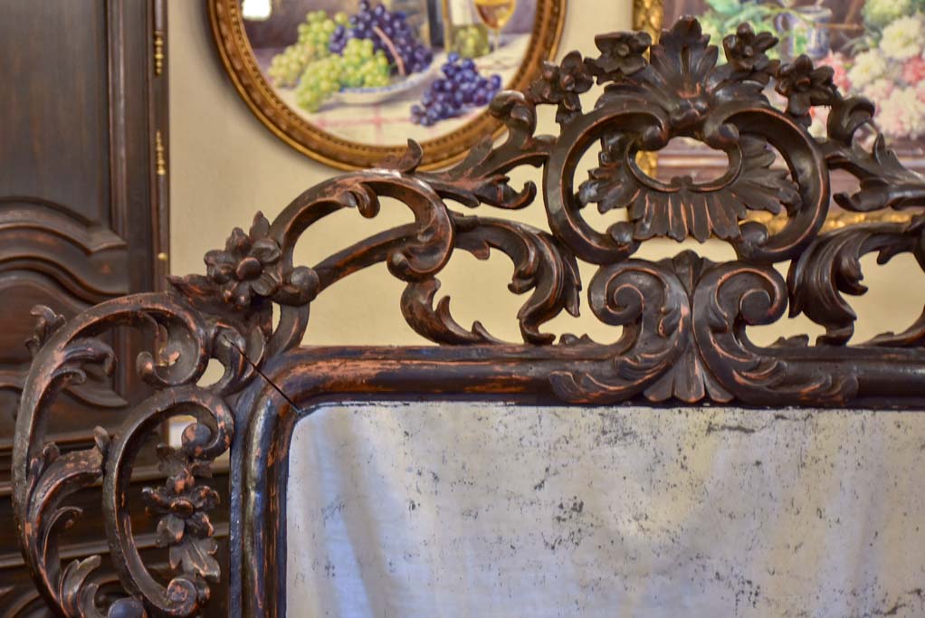 Large late 18th Century carved wood mirror with original black patina and aged glass 45¾" x 63½"