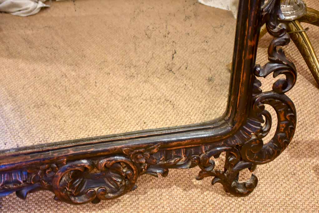 Large late 18th Century carved wood mirror with original black patina and aged glass 45¾" x 63½"