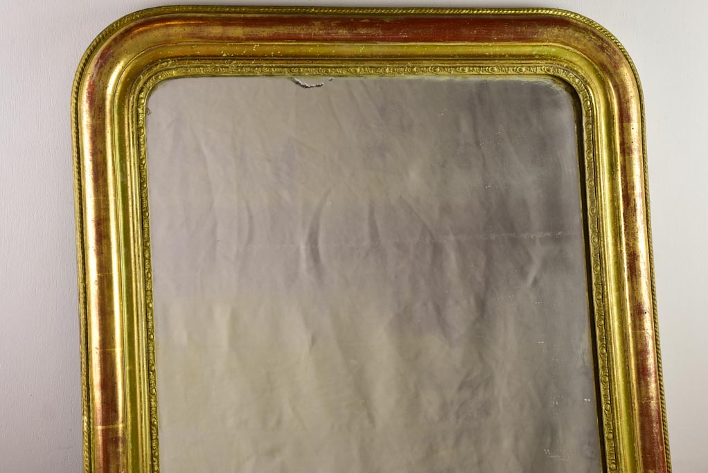 Timeworn gilt Louis Philippe mirror from the 19th century 27¼" x 37¾"