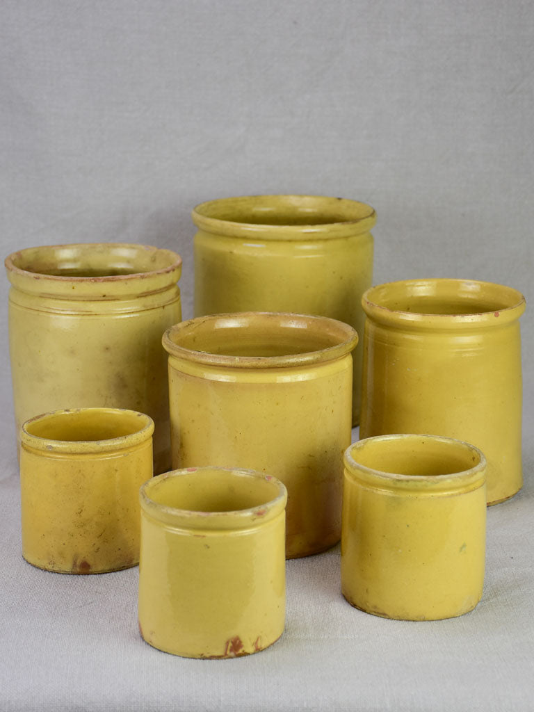 Collection of 7 antique French yellow ware preserving pots