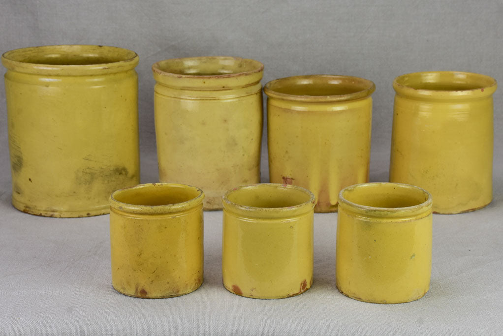 Collection of 7 antique French yellow ware preserving pots