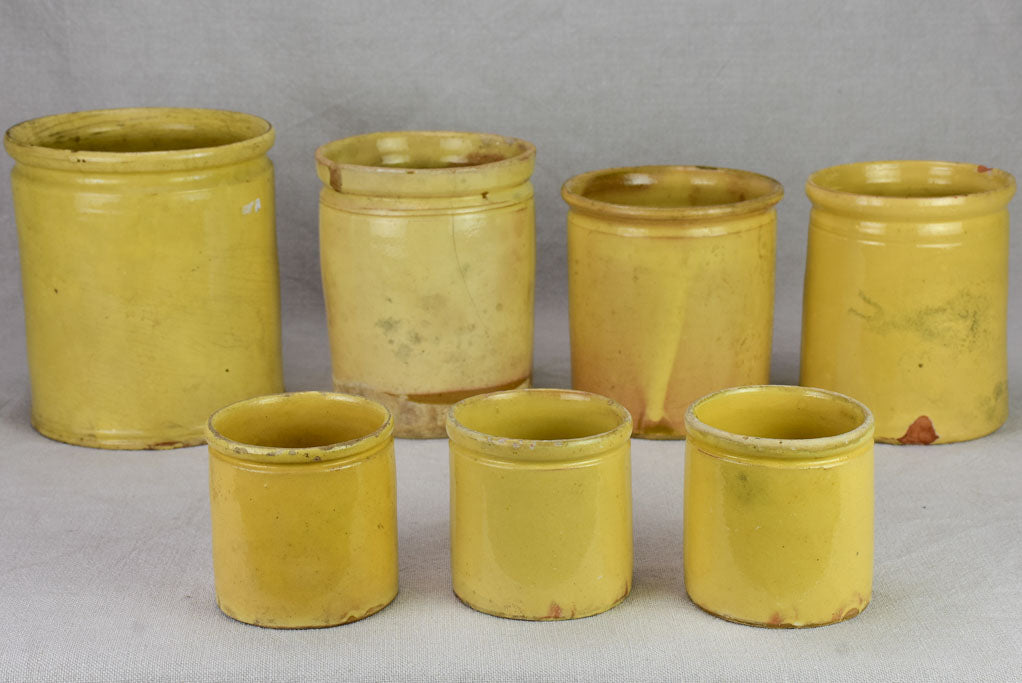 Collection of 7 antique French yellow ware preserving pots