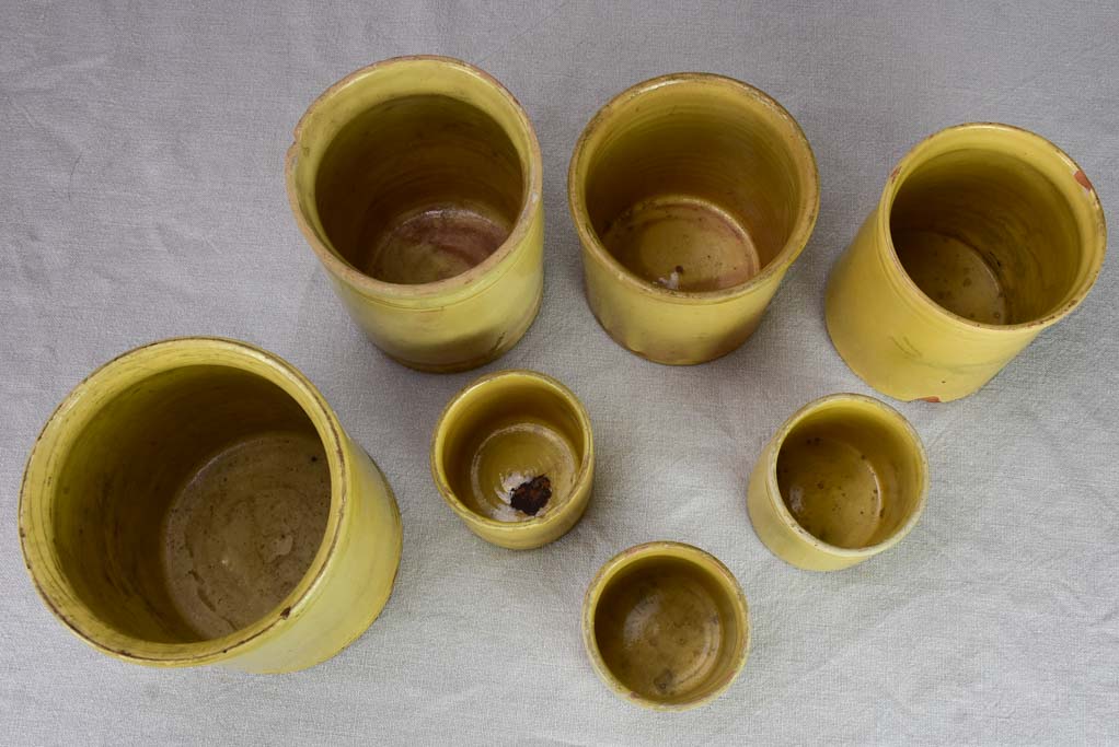 Collection of 7 antique French yellow ware preserving pots