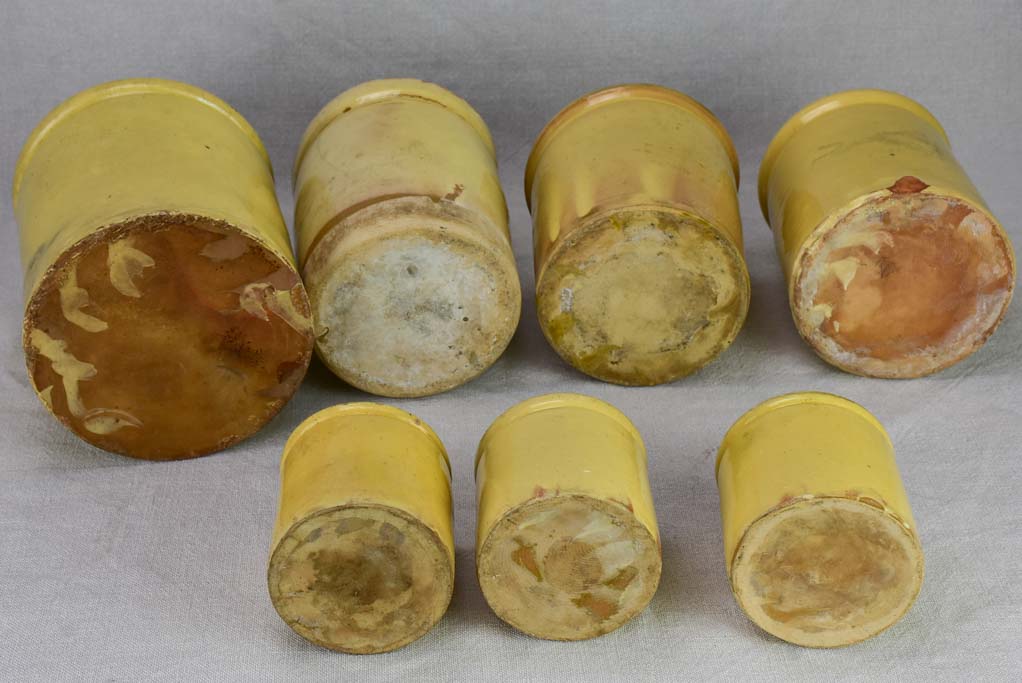 Collection of 7 antique French yellow ware preserving pots