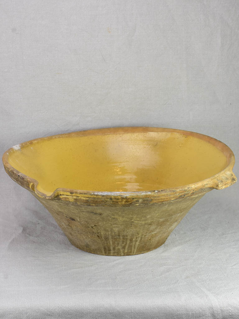 Very large antique French tian bowl with yellow glaze and handles 24"