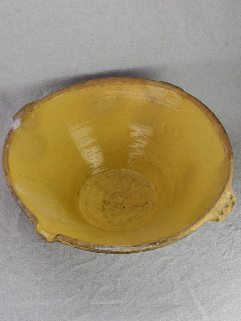 Very large antique French tian bowl with yellow glaze and handles 24"