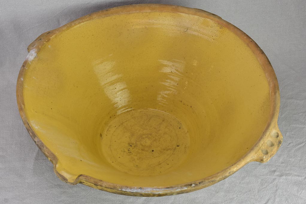 Very large antique French tian bowl with yellow glaze and handles 24"