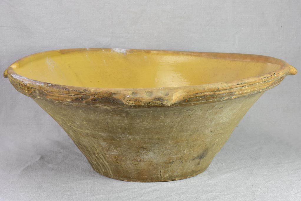 Very large antique French tian bowl with yellow glaze and handles 24"