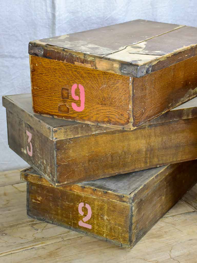 Collection of six large antique wooden boxes from a fabric boutique