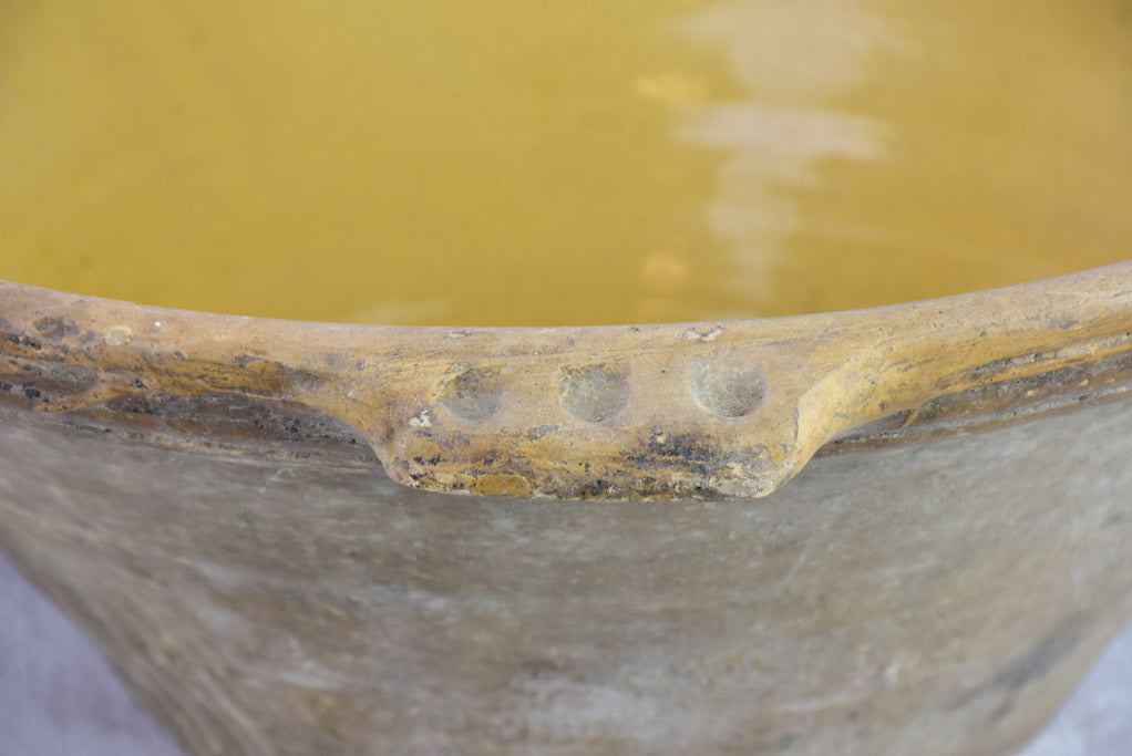 Very large antique French tian bowl with yellow glaze and handles 24"