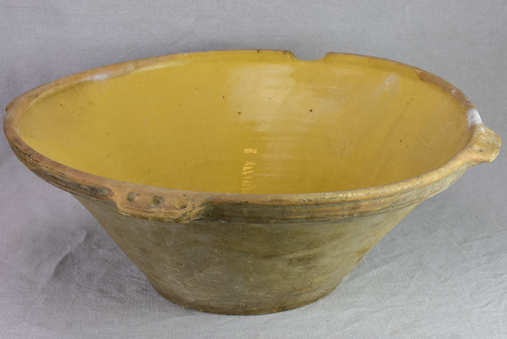 Very large antique French tian bowl with yellow glaze and handles 24"