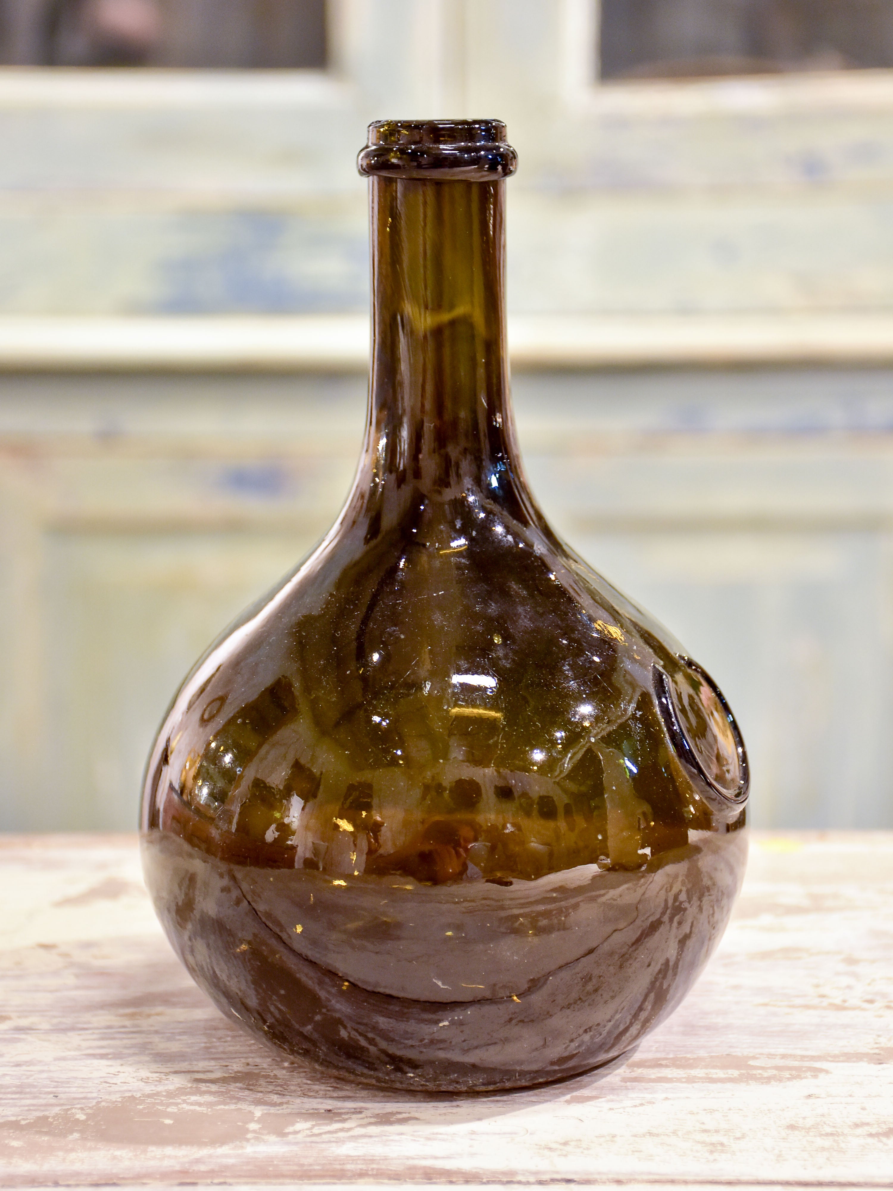 Small antique 'onion' bottle with dark green glass