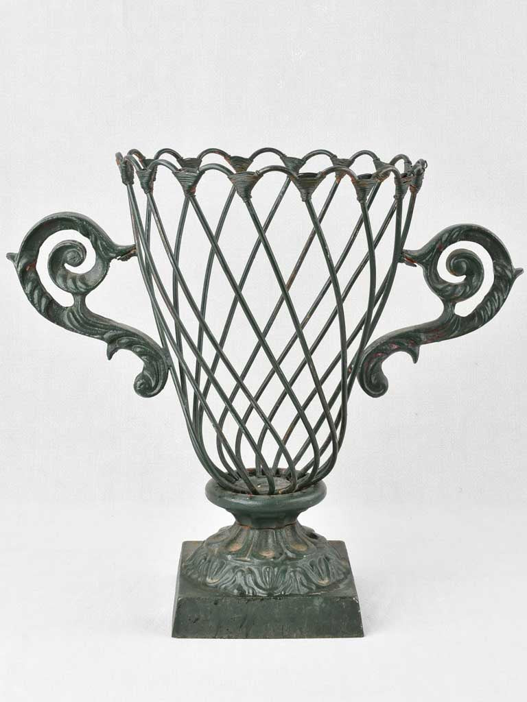 Vintage, cast iron jardiniere with wirework