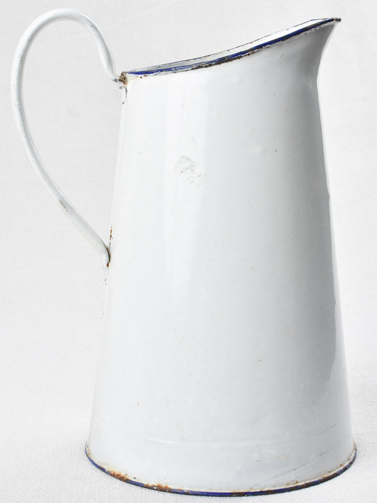 Antique enamel pitcher in navy white