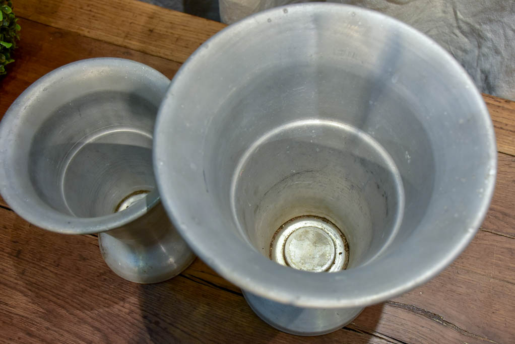 Two vintage French florist vases with weighted bases