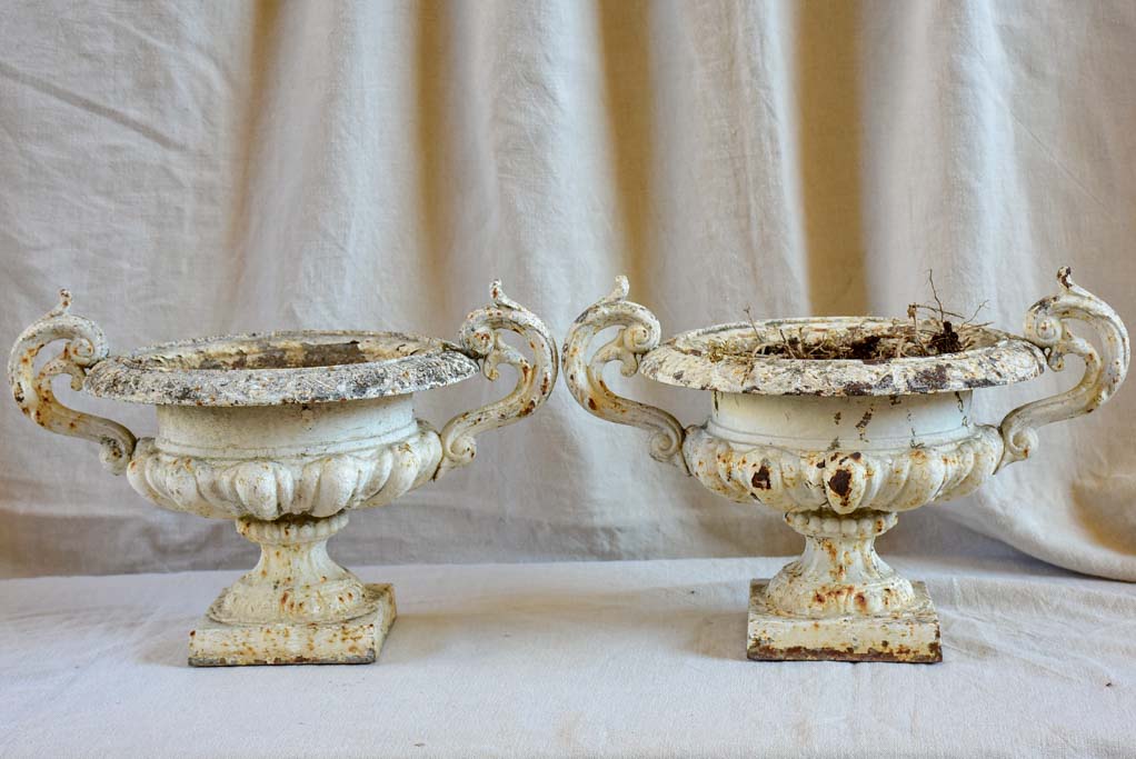 Pair of antique French Medici urns with handles