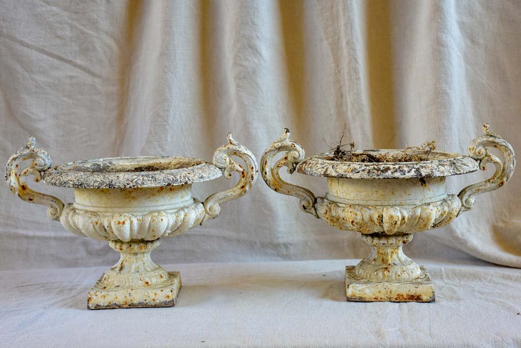 Pair of antique French Medici urns with handles