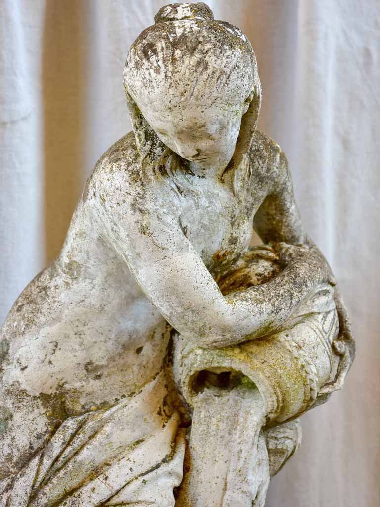 Garden fountain / sculpture of a draped woman with a water jug