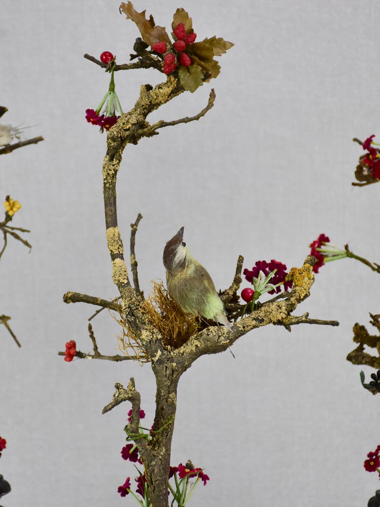 Collection of three artisan made birds on branches mounted on salvaged wooden supports 18"