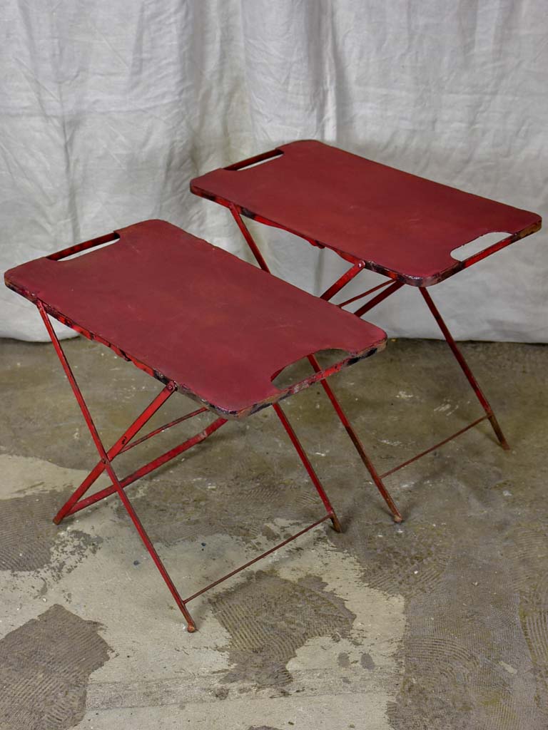 Two industrial French side tables - red